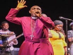 Female pastor leading a diverse congregation in an indoor church setting, fostering unity and spirituality.